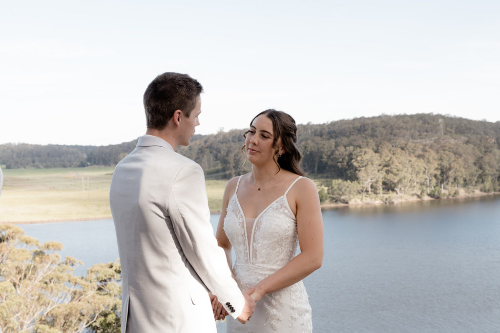 Bride and Groom sharing vows looking over Shoalhaven River