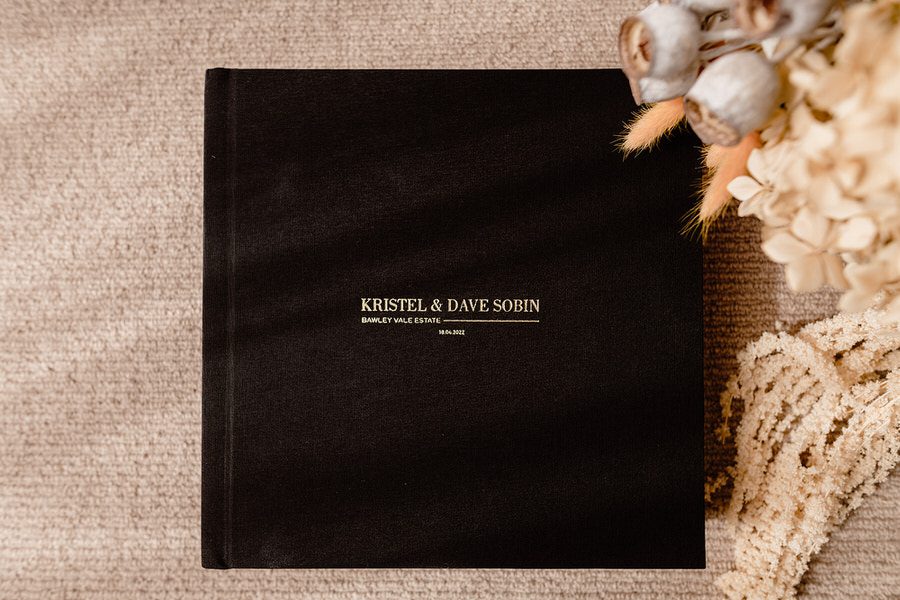 The front cover of a Black linen covered wedding album Custom embossed