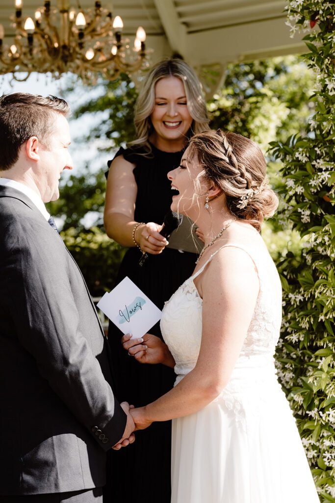 Bride laughing in the ceremony at Ravensthorpe Albion Park
